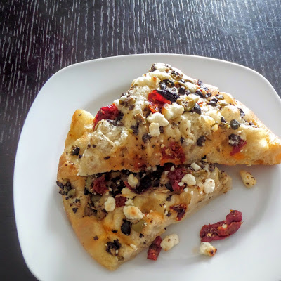 Focaccia Pizza:  An Italian flat bread made with a wet dough, shaped into a pizza, and topped with tapenade, sun-dried tomatoes, and feta cheese (or toppings of your choosing).