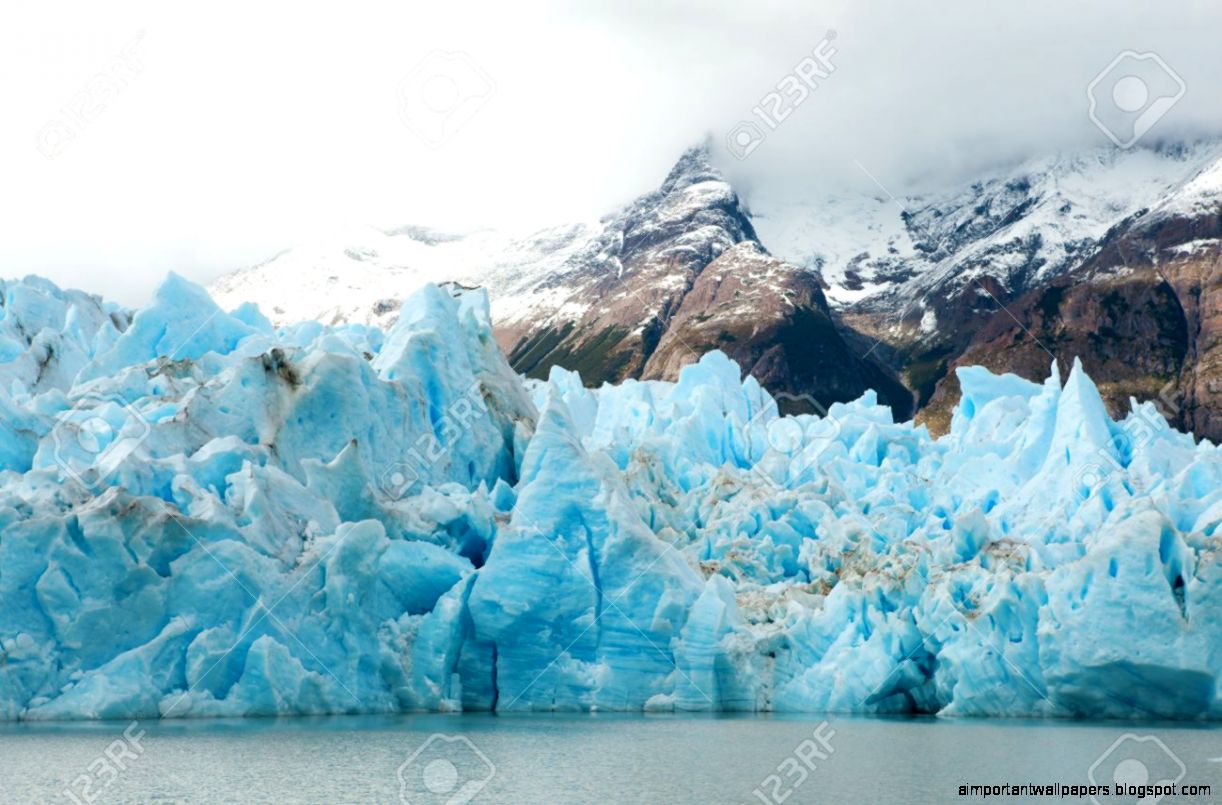 Blue Icebergs And Snowy Mountains At Grey Glacier In Torres Del Blue Icebergs And Snowy Mountains At Grey Glacier In Torres Del
