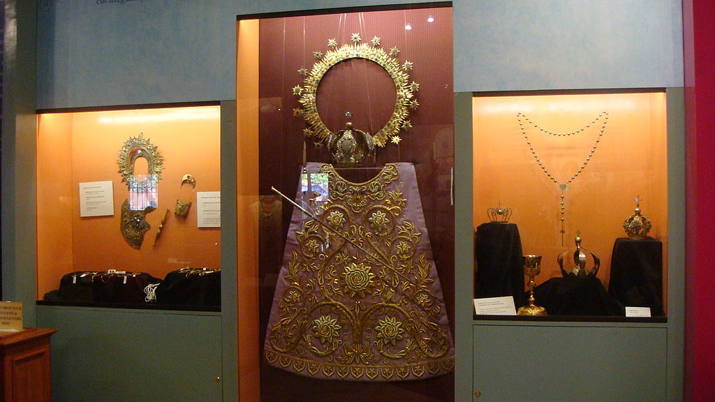 Old regalia of the image including its breastplate, haloes, crowns, sceptres, baton, and vestments
