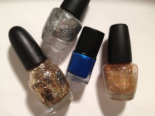 you belong with me, taylor swift inspired nail art, glitter nail tutorial, taylor swift nails, metallic blue nail polish, gold and silver glitter nail polish, uses for painter's tape, triangle moon mani, junior jewels