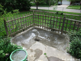 formed concrete pond in backyard, build by hand