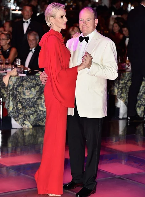  Princess Charlene of Monaco wore Valentino One Shoulder Jumpsuit in Red.
