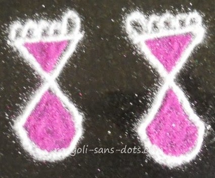 a simple representation of the feet of God in rangoli God-feet-in-rangoli-.jpg