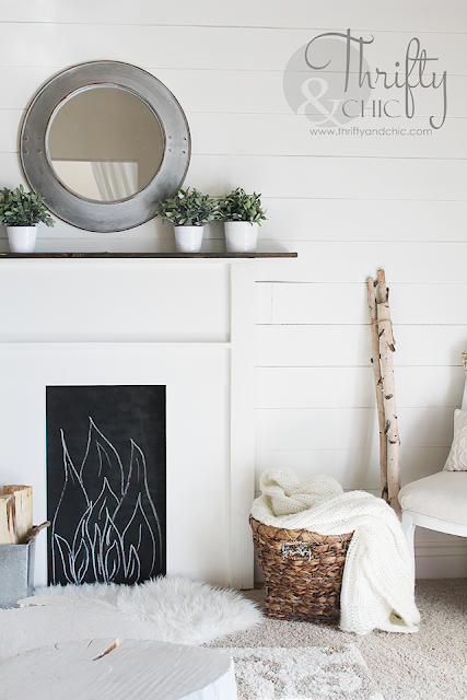 DIY faux fireplace surround and mantel. Made for under $50, would be perfect with stockings for the holidays!