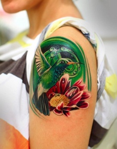 Humming bird and amazing color tattoo on shoulder
