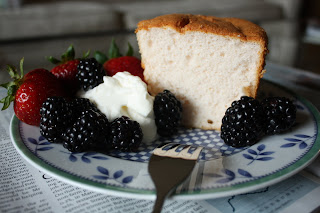 Slice of angel cake with whipped cream & berries