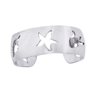 Vintage 1990's silver Hermes cuff bracelet with starfish cut-outs.
