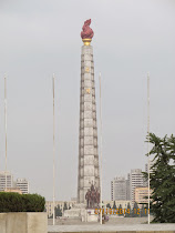 Tower of the Juche Idea, Pyongyang (statues at base are 98 feet tall !)