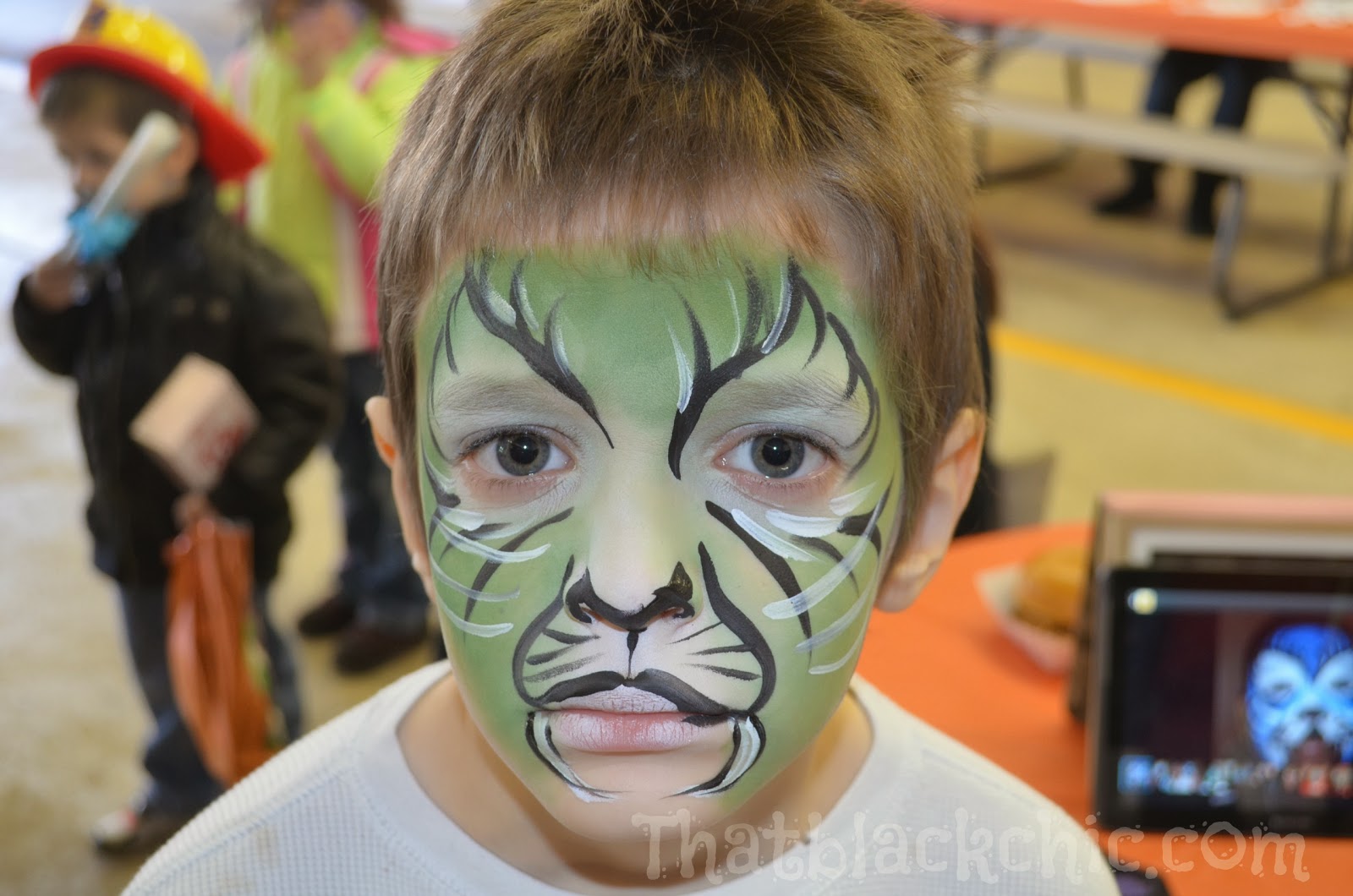 Giving back by volunteering Face Painting the kiddies That Black Chic