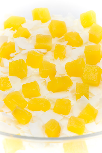 Tropic trifle close up on top with mango cubes