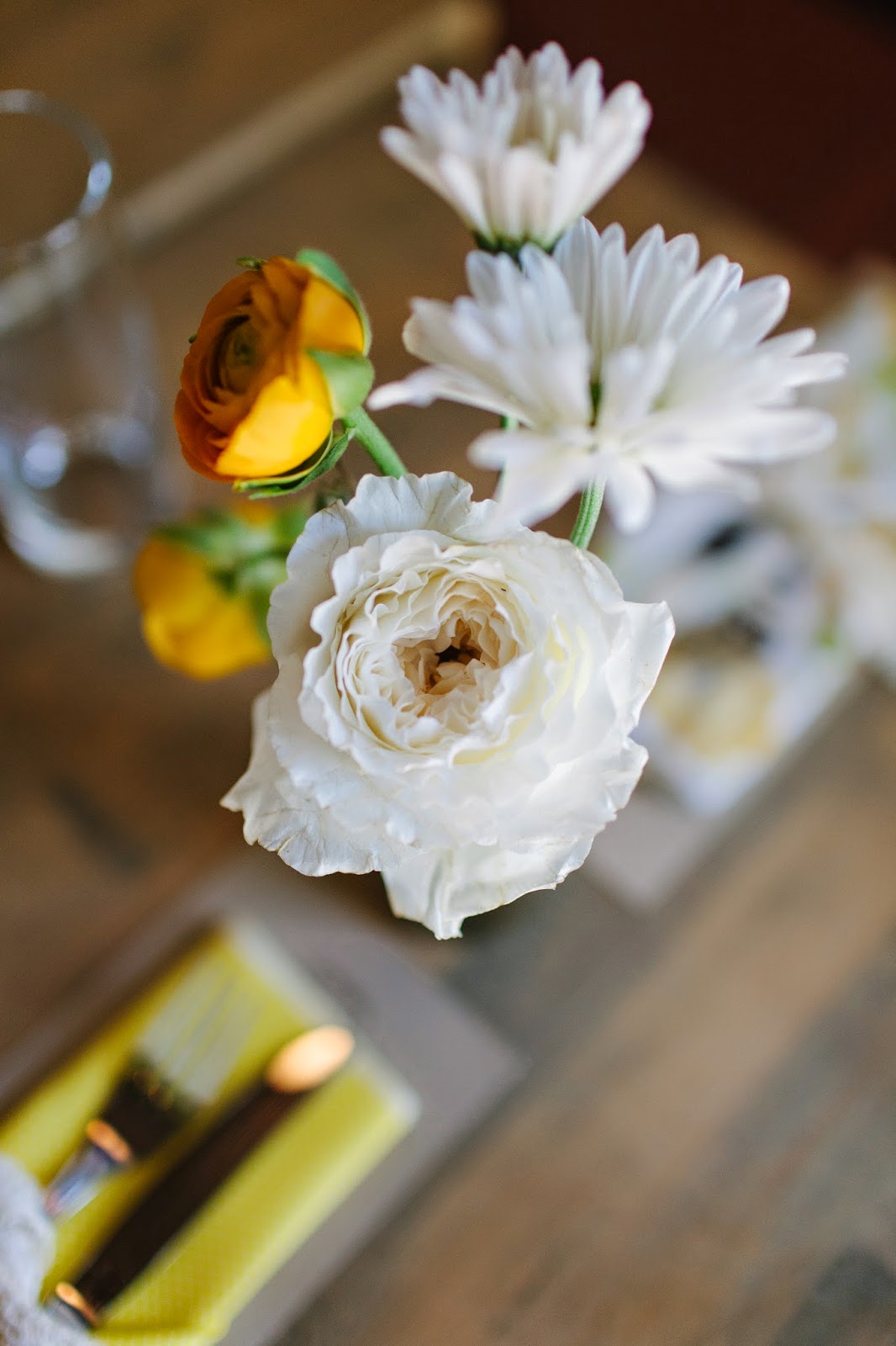 yellow ranunculus and white patience garden rose spring wedding dinner centerpiece in brooklyn, new york