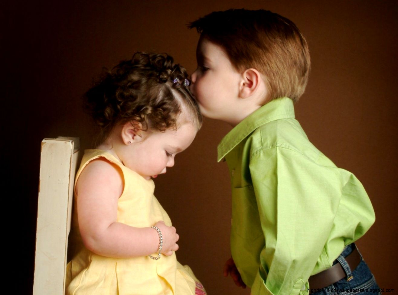 Cute Little Boy and Girl Kissing Cute Little Boy and Girl Kissing