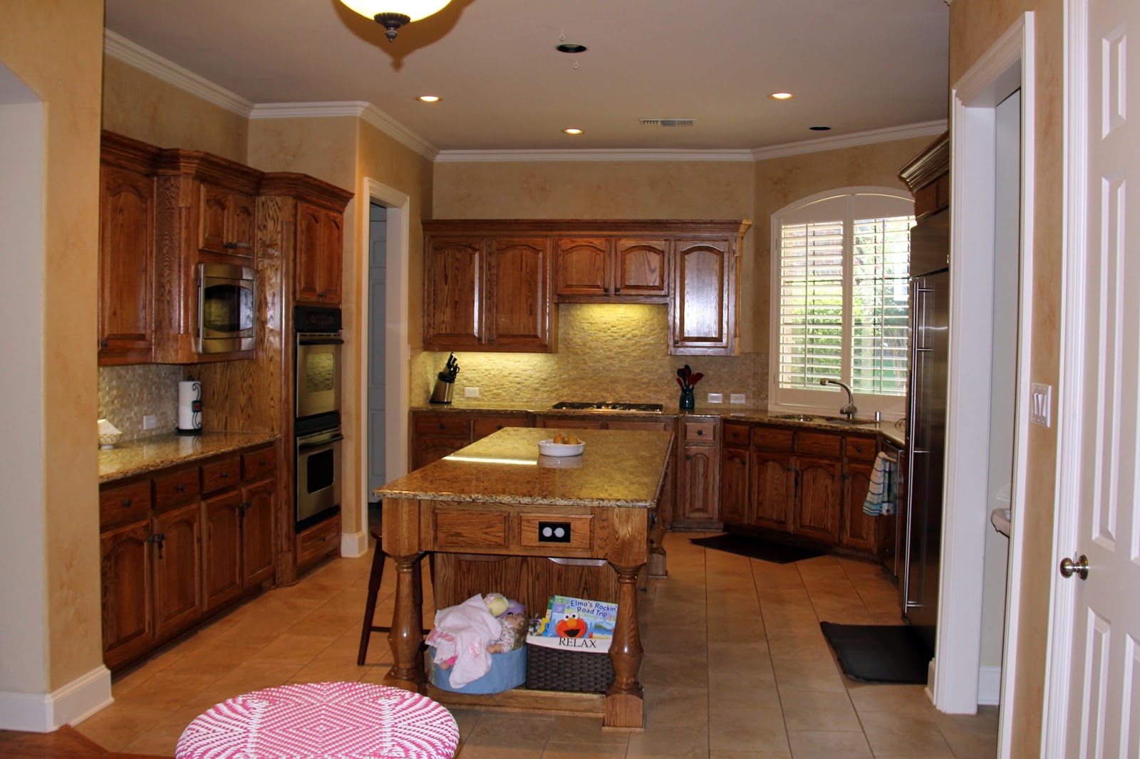 Faux kitchen backsplash Just past the giant boob light is the eat in kitchen area with a