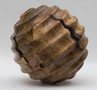 maple wooden ball with concentric rings top to bottom, 2 feet in diameter
