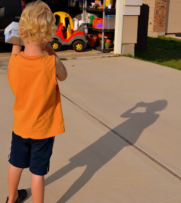 The Geesamans testing their home-made viewer before the eclipse - May 20, 2012