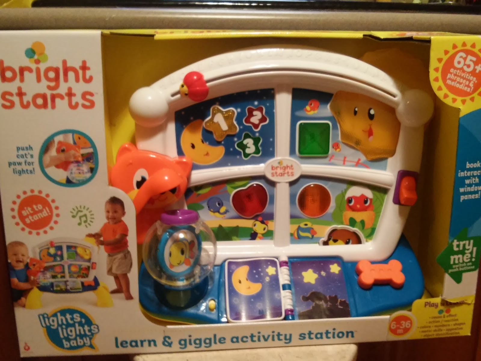 bright starts lights baby learn and giggle activity station