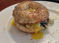 Sausage and Egg on a Bagel with Spinach and Goat Cheese