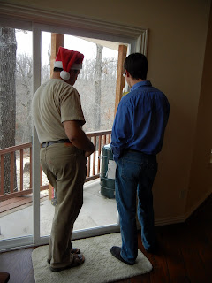 My husband and dad discussing how to properly use the new smoker