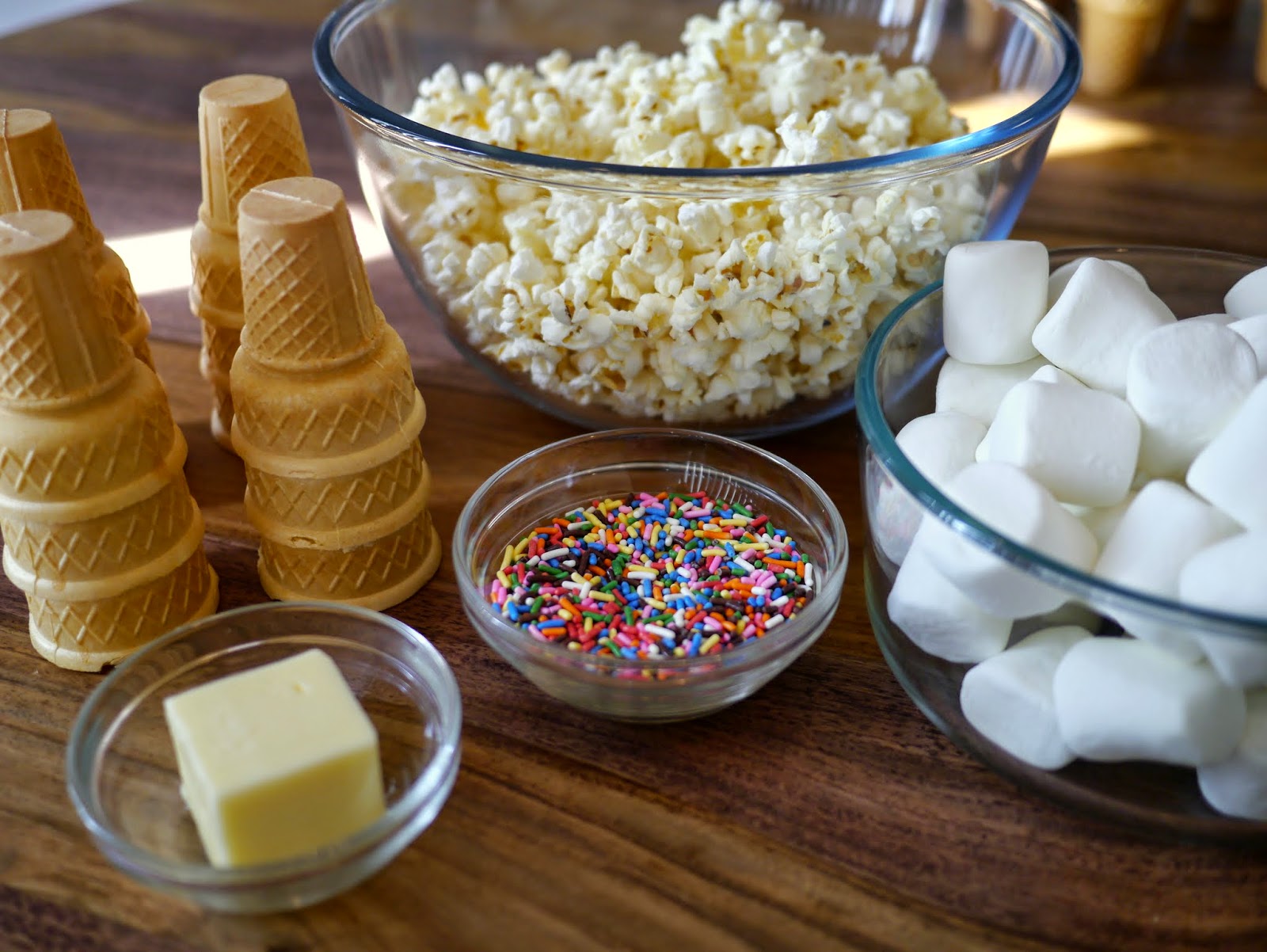 Pop the popcorn in the microwave. Remove any unpopped kernels and set