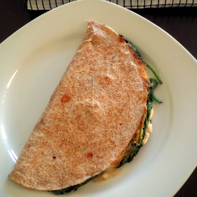 Spanakopita Quesadilla:  A fusion of Mexican and Greek cuisines.  Spinach, feta, and mozzarella packed into a whole wheat tortilla and fried.