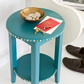 an embellished side table. via good housekeeping
