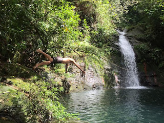 Remax Vip Belize: Dave diving into a waterfall pool