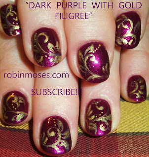 purple and gold nail, mahogany nail, crimson glam nail, cherry nail, ruby red nail, rasta snowman nail, rasta lion nail, rasta christmas design, rasta christmas, rasta nail, lion zion, rasta frosty the snowman, filigree nail, nail scrolling tutorial, filigree tutorial, how to paint filigree, rasta candy,