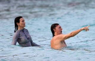 Nancy Shevell, 56, developing her natural charm in a gray top and yellow bikini and the Beatles musician, Sir Paul McCartney, 73, covered his muscle in a blue trunks as they wandered around the sea of Saint-Barthélemy on Monday, December 28, 2015.