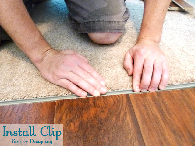 Install Clip for Transition Strip to concrete floor after laying laminate flooring