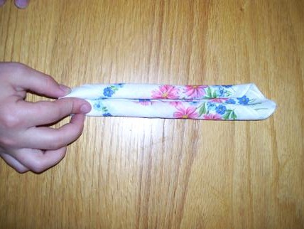 handkerchief them chaos joyful tightly corners grasp rolling lower middle both meet making start would