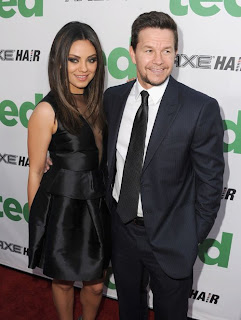 Mila Kunis and Mark Walhlberg pose together at Ted premiere in Los Angeles