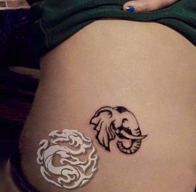 small elephant tattoo on the hip