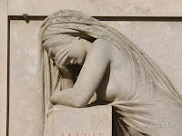 http://www.popscreen.com/p/MTMzMjAzNTA5/Stone-Sculpture-of-Woman-Crying-with-Face-in-Hands-Photographic-Print-