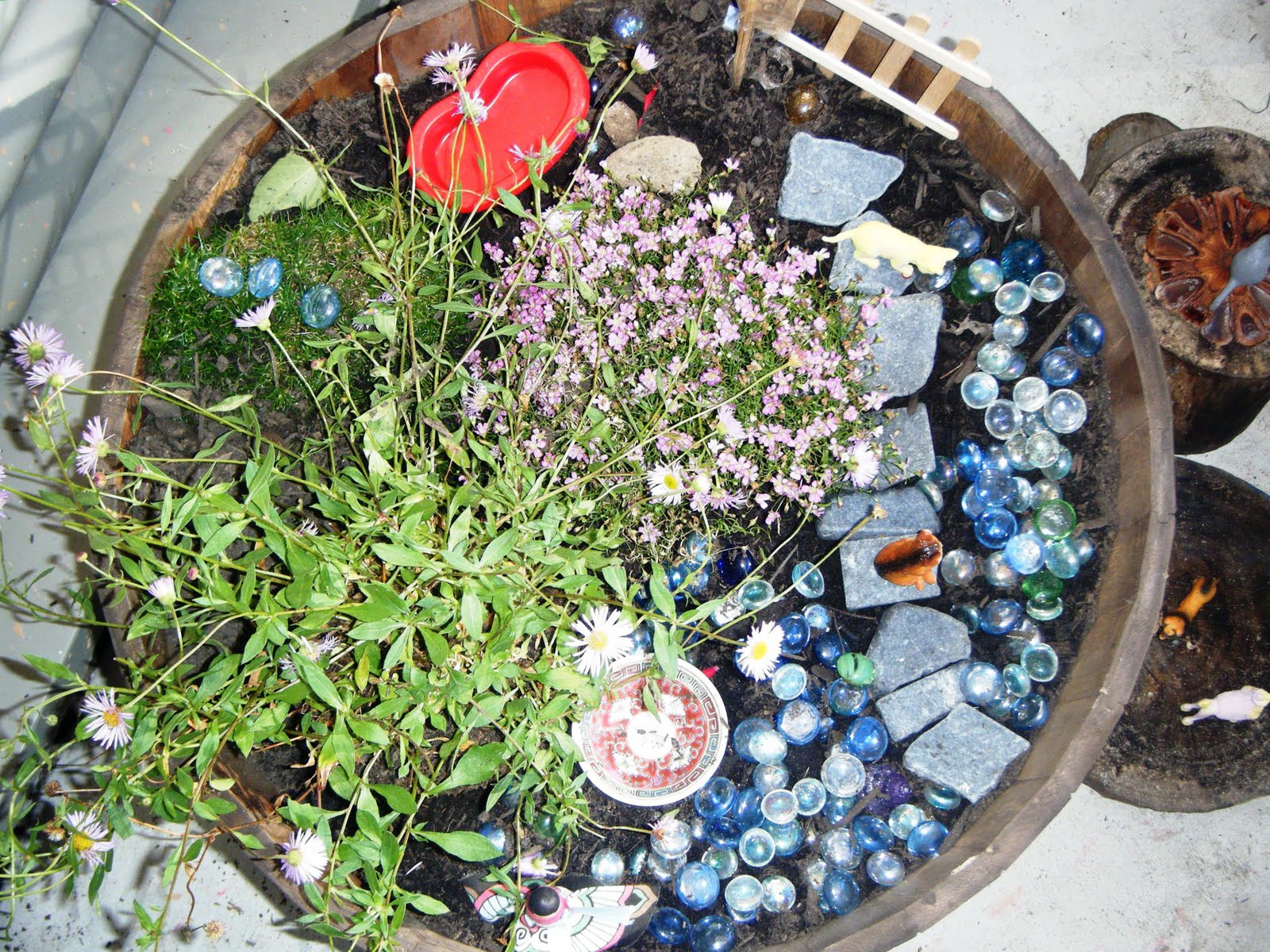 let the children play creating a fairy garden in a pot
