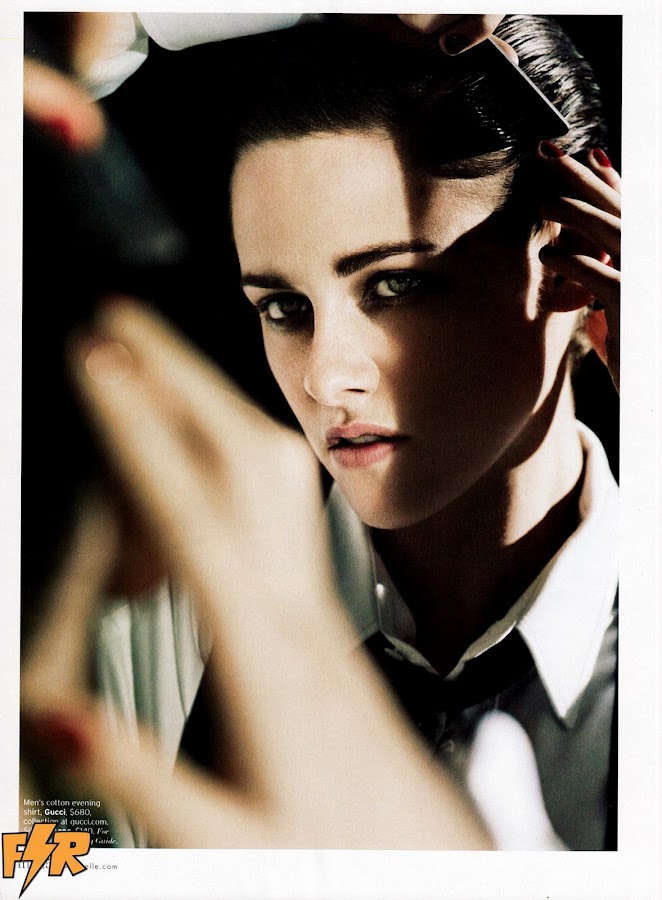 Kristen Stewart dressed like a man and combing her hair