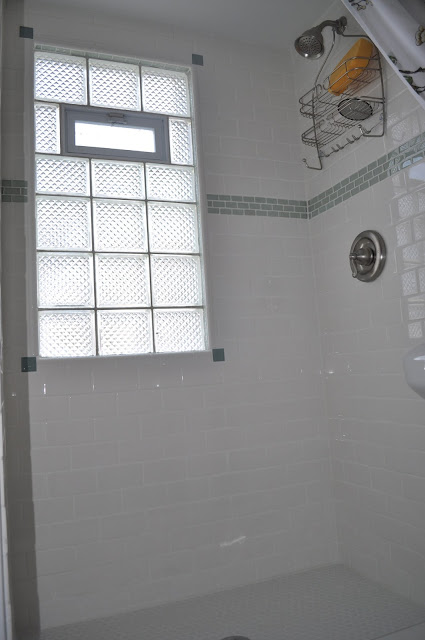 bathroom, reno, subway tile, sea glass tile, glass tile, white grout, grout, glass block window, hex tile