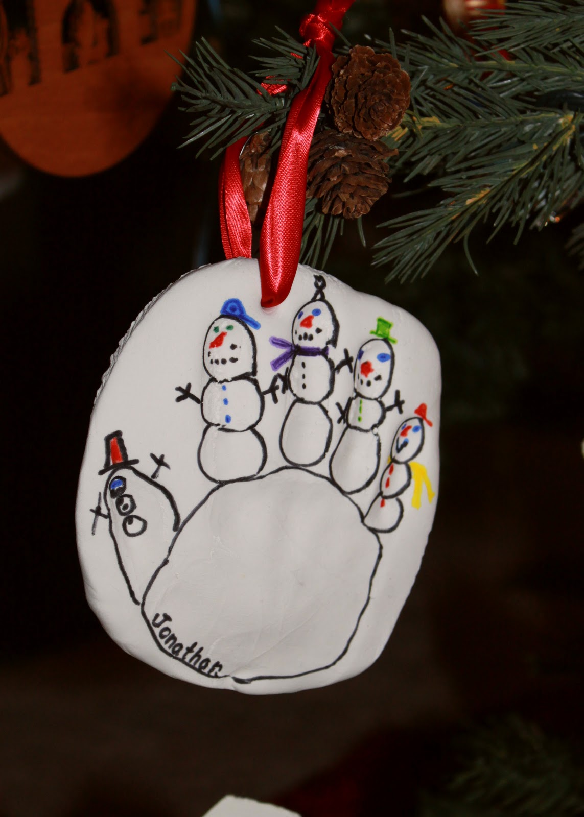 Make A Fun Snowman Handprint Ornament This Christmas