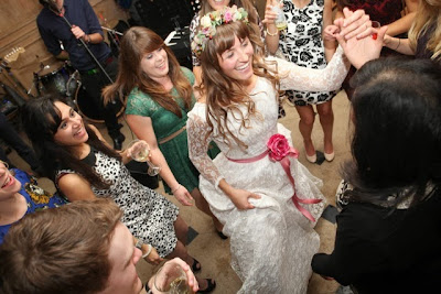 Real vintage bride Olivia in 1960s lace vintage wedding dress, dancing at Anstey Hall