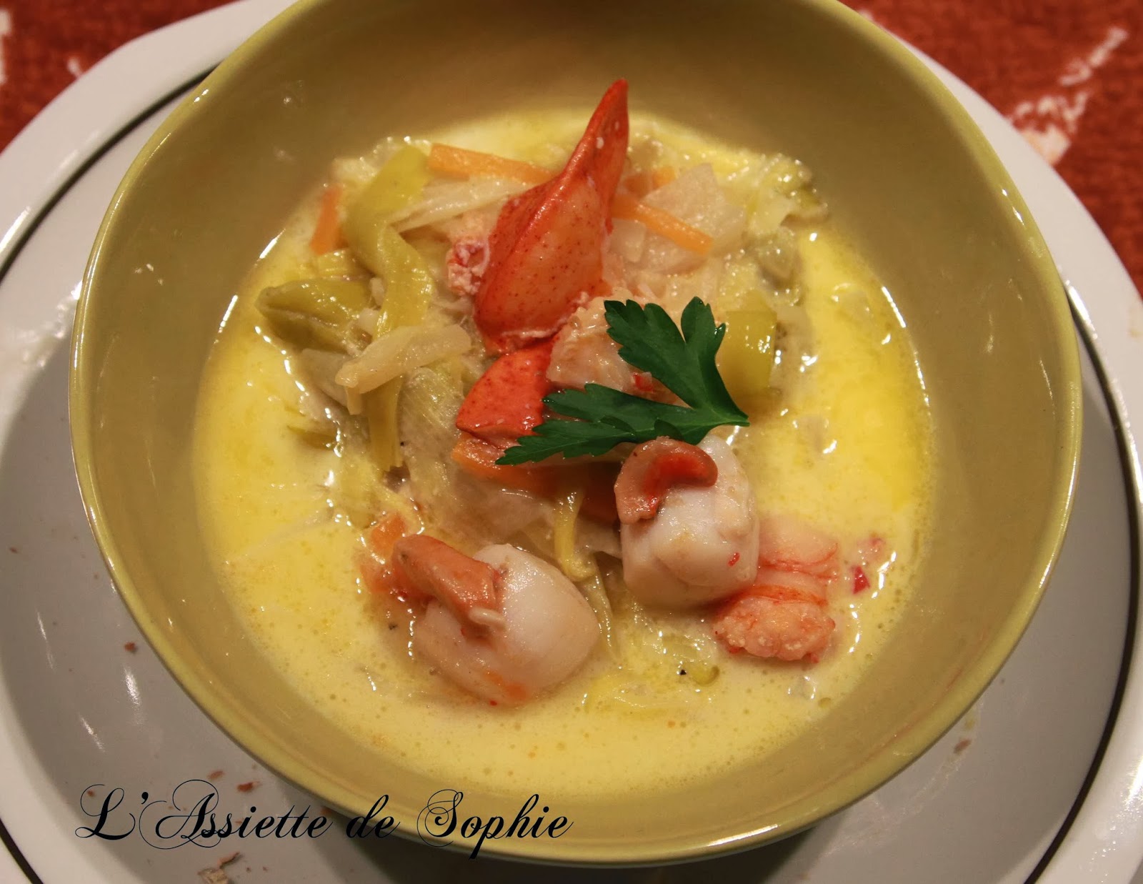 L' assiette de Sophie Nage de Homard et de St Jacques au safran