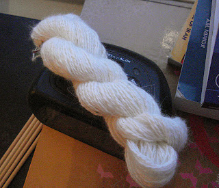 Hand spun on drop spindle brilliant white angora bunny halo yarn