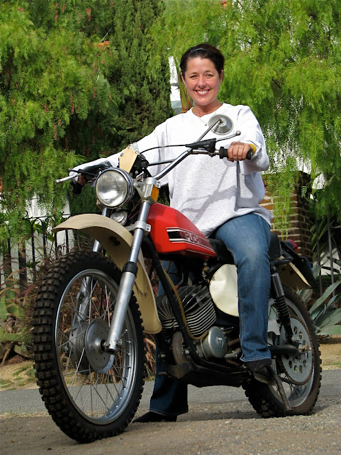 She'll hate me for this...but Maggie in cleaning clothes on our vintage Puch.