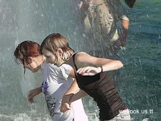 College girls playing in fountain