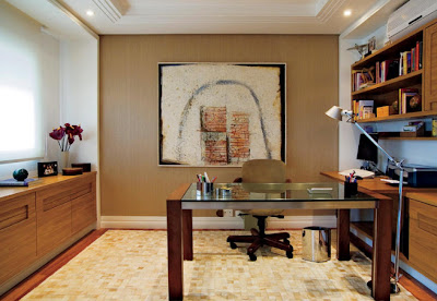 home office with wood cabinets and glass table
