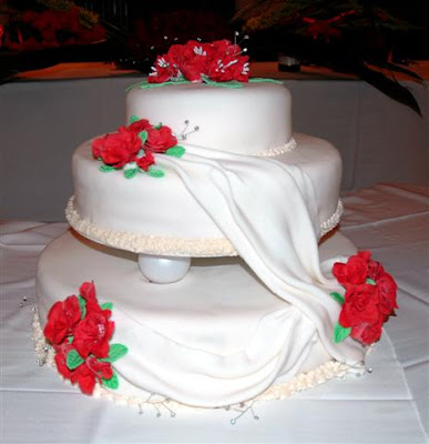 3 Tier Wedding Cake Top layer covered in fantasy flowers 3 Tier Wedding Cake Top layer covered in fantasy flowers