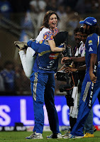 Nita Ambani celebrates as she is lifted by Harbhajan Singh.