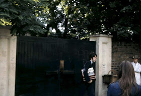 Paul McCartney carrying an accordion