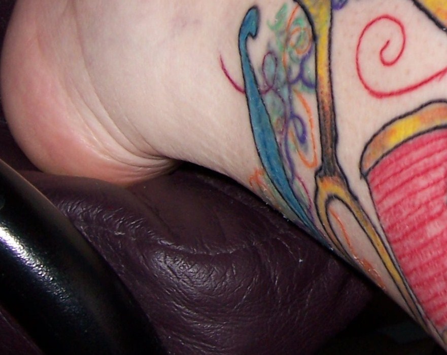 Here are a few pictures of the new tattoo. It's still crusty and peeling and 