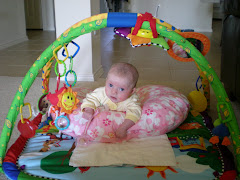 Cammie playing with her gym.