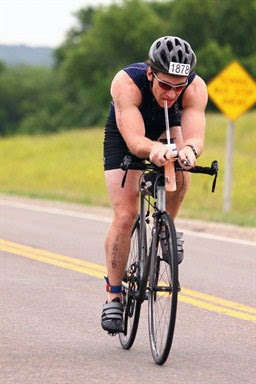 Aaron Fanetti biking in Ironman 70.3 Kansas