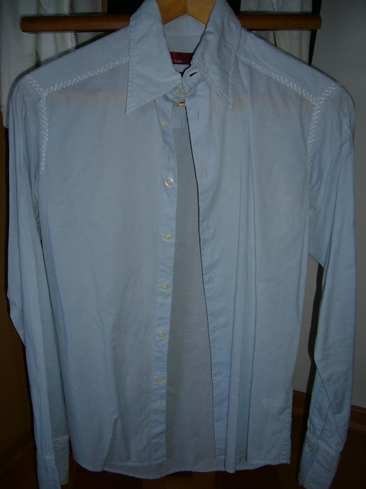 Camisa azul clara manga comprida - 7,50 arcas